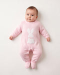 Dandelion pink knitted romper suit with a white bunny and satin ribbon