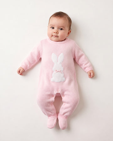 Dandelion pink knitted romper suit with a white bunny and satin ribbon