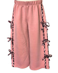 Girls dusky pink flared trousers with animal print bows