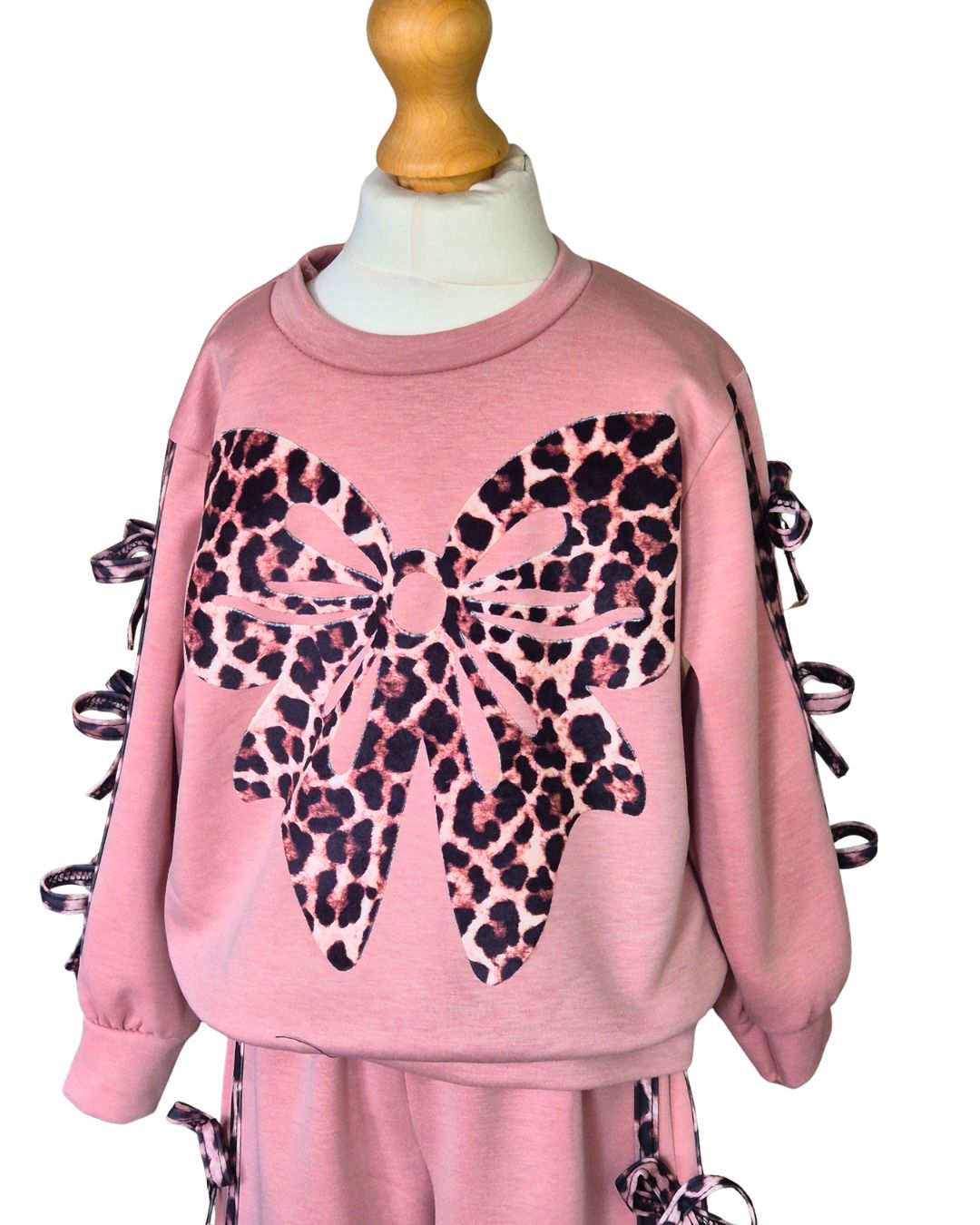 Girls dusky pink leisure suit with statement animal print bow