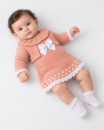 Baby girls’ dusky pink knitted dress and shrug set with white lace details