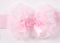 Pink Soft headband withPink bow with ruffles on a white background