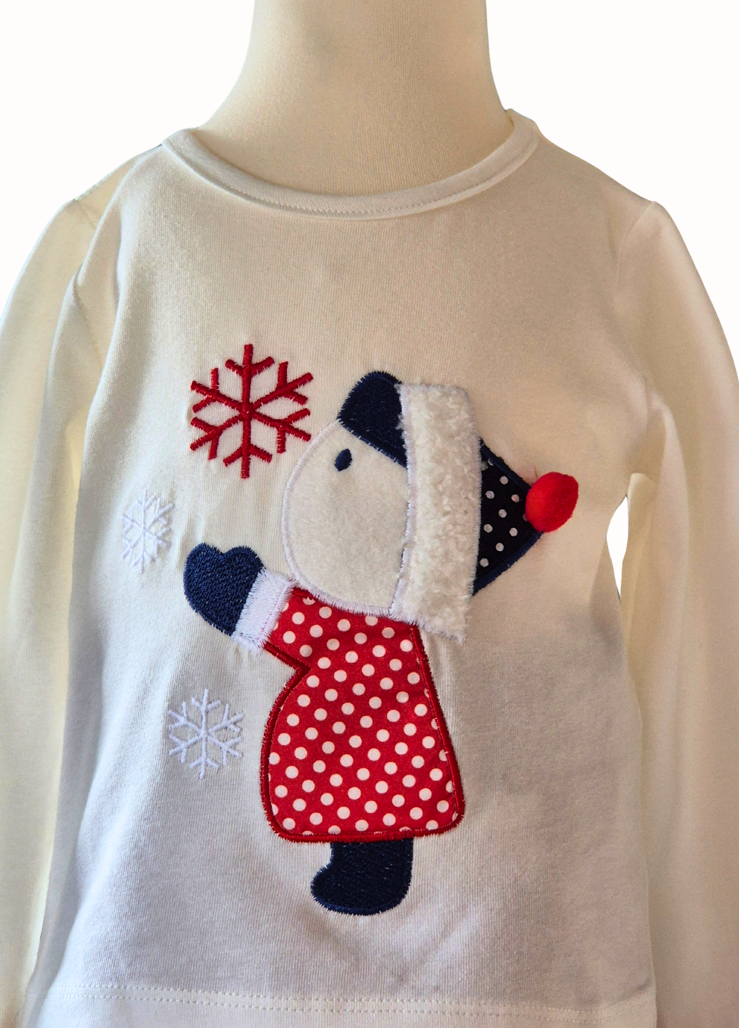 Close up of the top with a little girl catching a snowflake on a white background.