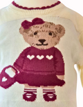 Close up detail of the girl bear in her skirt and top and handbag
