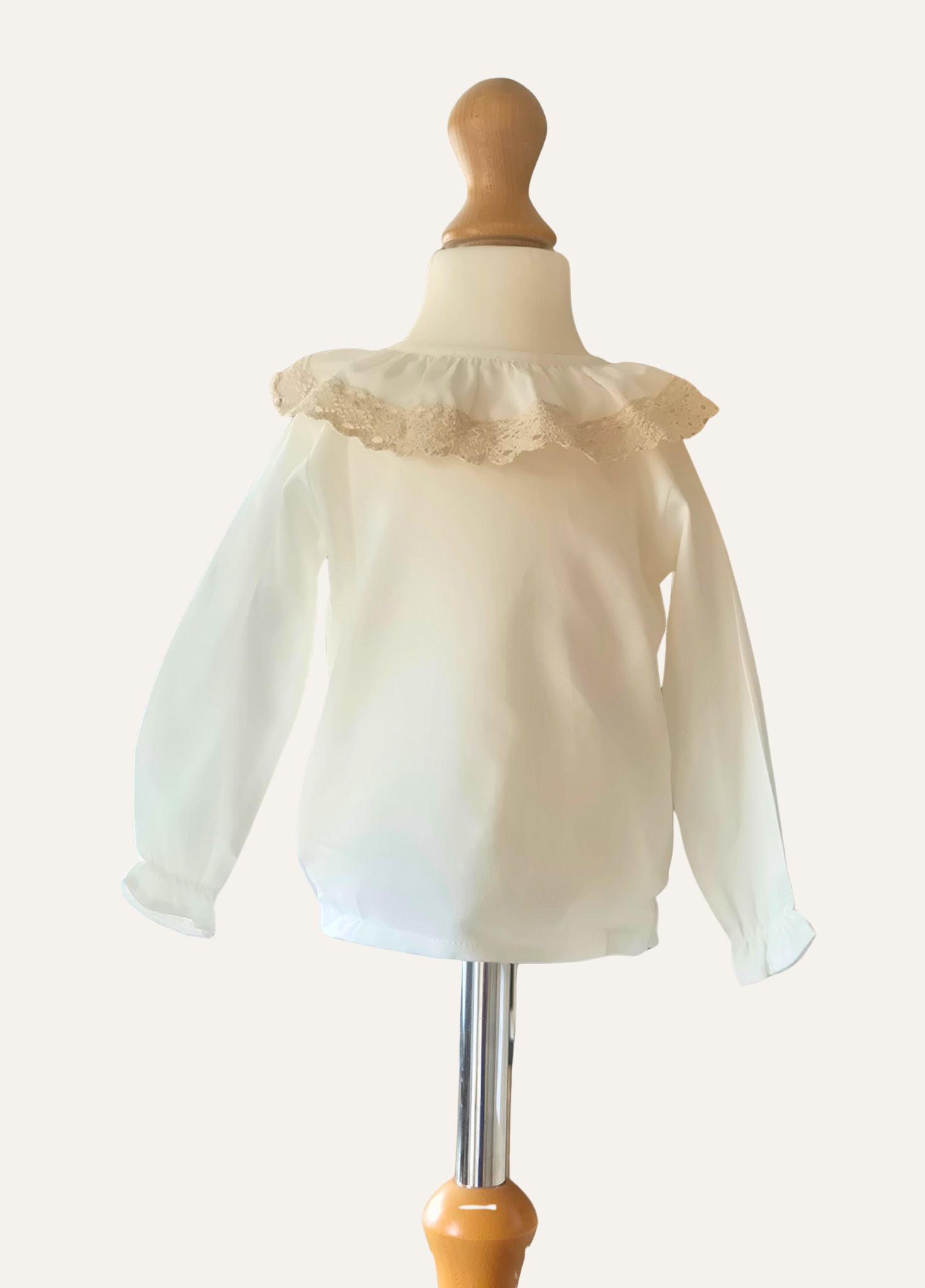 Spanish White blouse with lace collar on a mannequin
