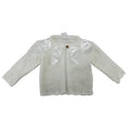 Ivory knitted cardigan with double silk bow details on a white background