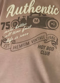 Brown t-shirt with vintage hot rod design and text on a brown background