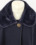 Girls’ classic navy cape with gold button fastening