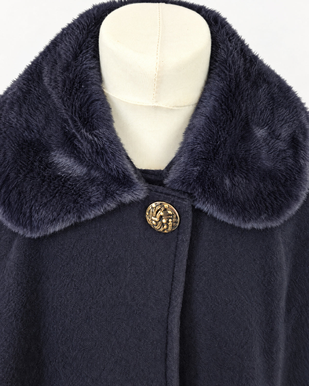 Girls’ classic navy cape with gold button fastening