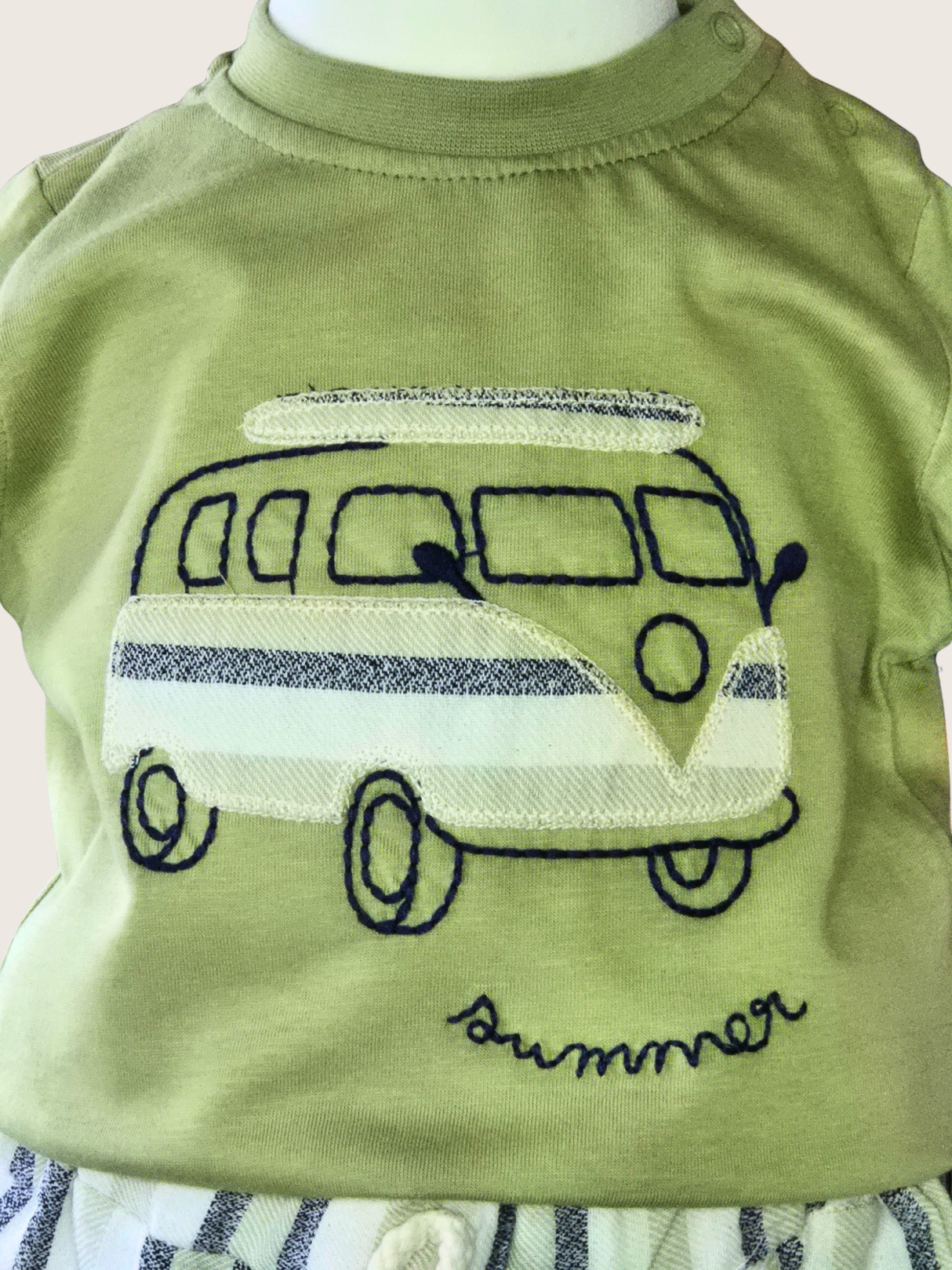 Green shirt with a camper van design and 'summer' text on a white background