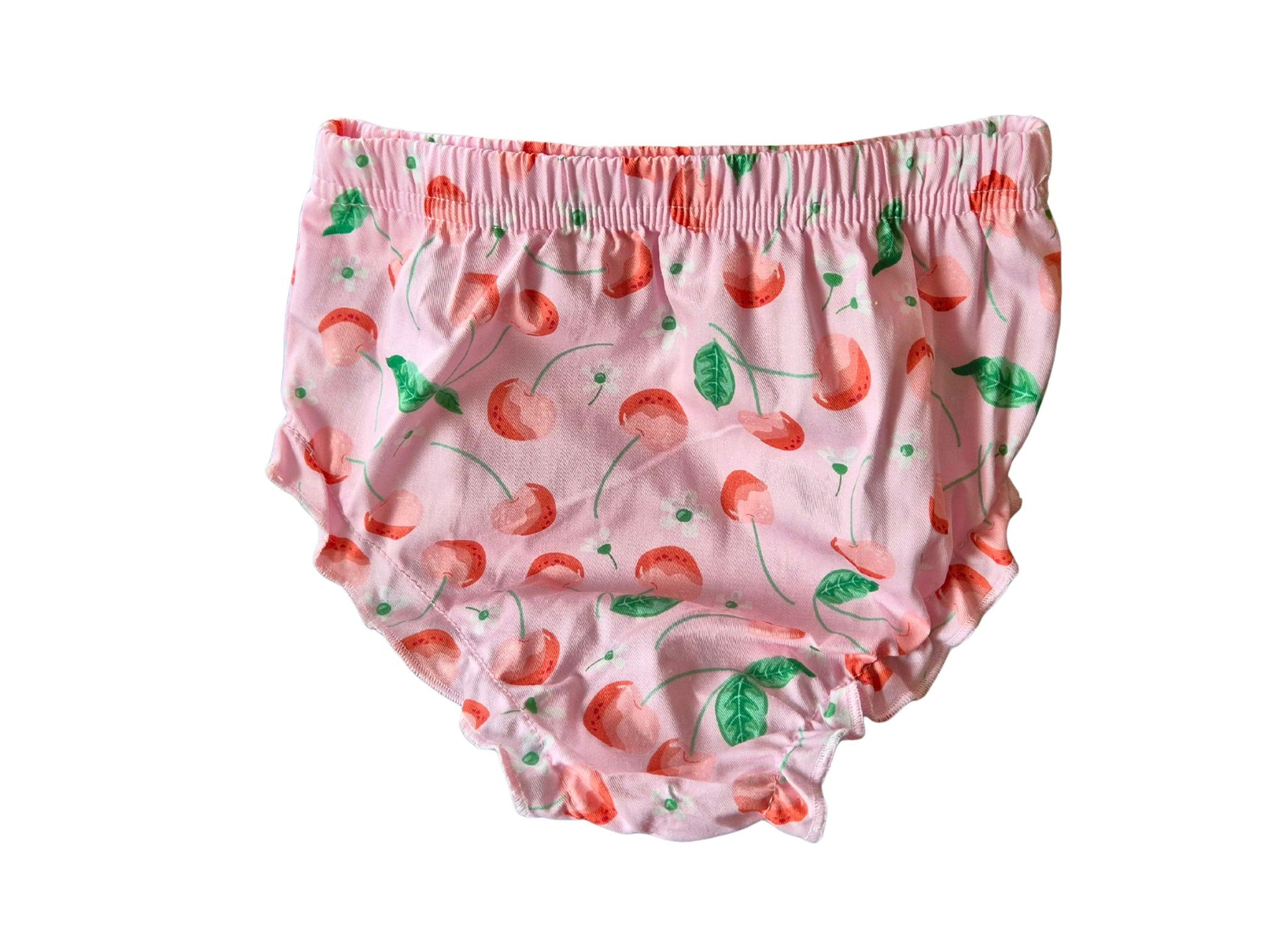 Pink children's bloomers with cherry pattern on a white background
