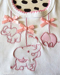 Baby bib with pink satin ribbon bow detail