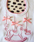 Baby bib with satin ribbon bow detail