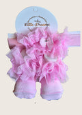 Pink ruffled socks and matching headband on a 'Little Dreams London' branded card