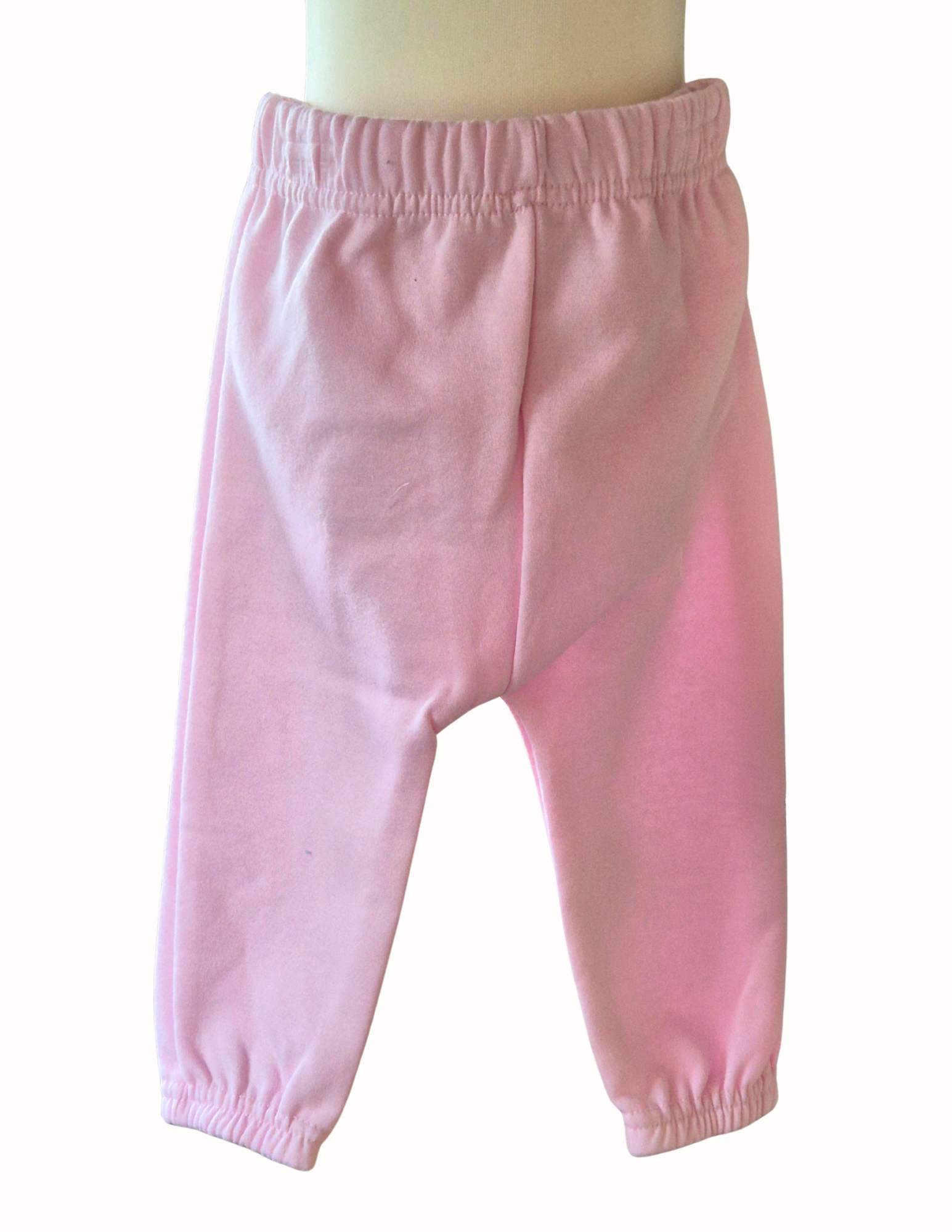 Pair of pink joggers which is part of the 2 piece set on a white background.