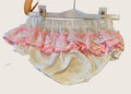 Pair of white knickers with pink and white lace frills to match the dress.