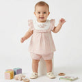 Spanish baby outfit in dusky pink with embroidered flowers
