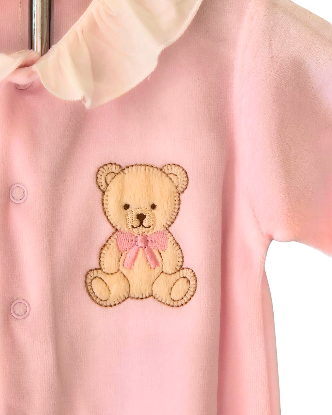Pink baby sleepsuit with frill neck