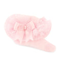 infant pink socks with a tulle tutu frill and a bow on a white background