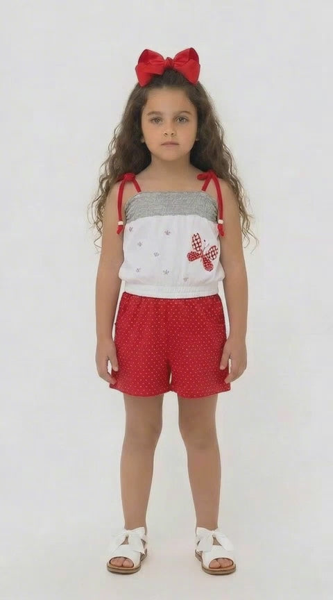 Children’s red polka dot summer playsuit with butterfly detail
