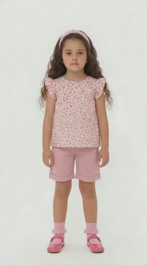 Girls dusky pink knee length shorts and floral floaty top summer outfit