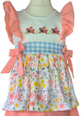 Children's top with floral skirt and embroidered top on a mannequin against a white background