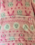 Pink fleece material with rabbits and sheep 