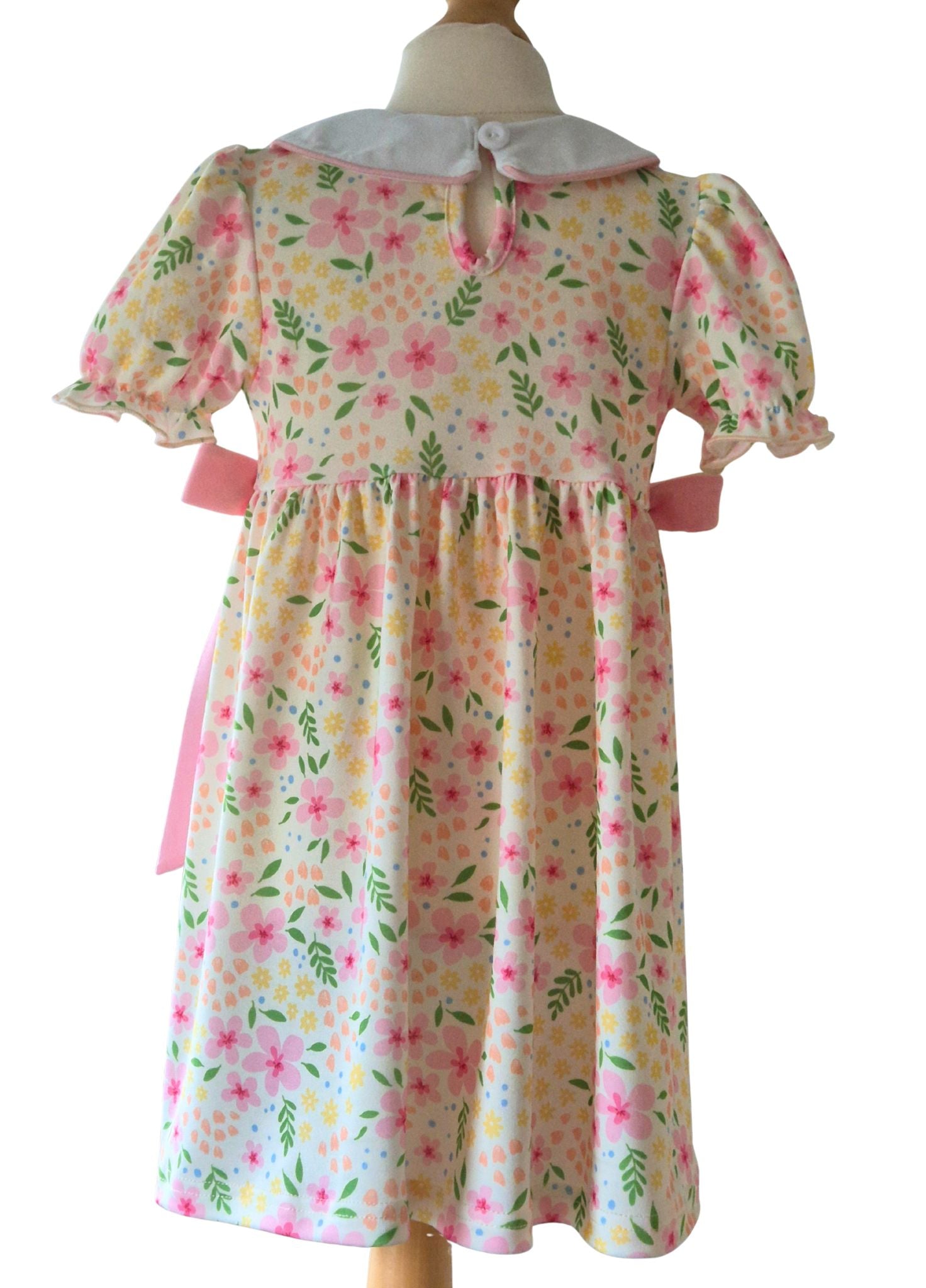 Floral dress on a mannequin with a white background
