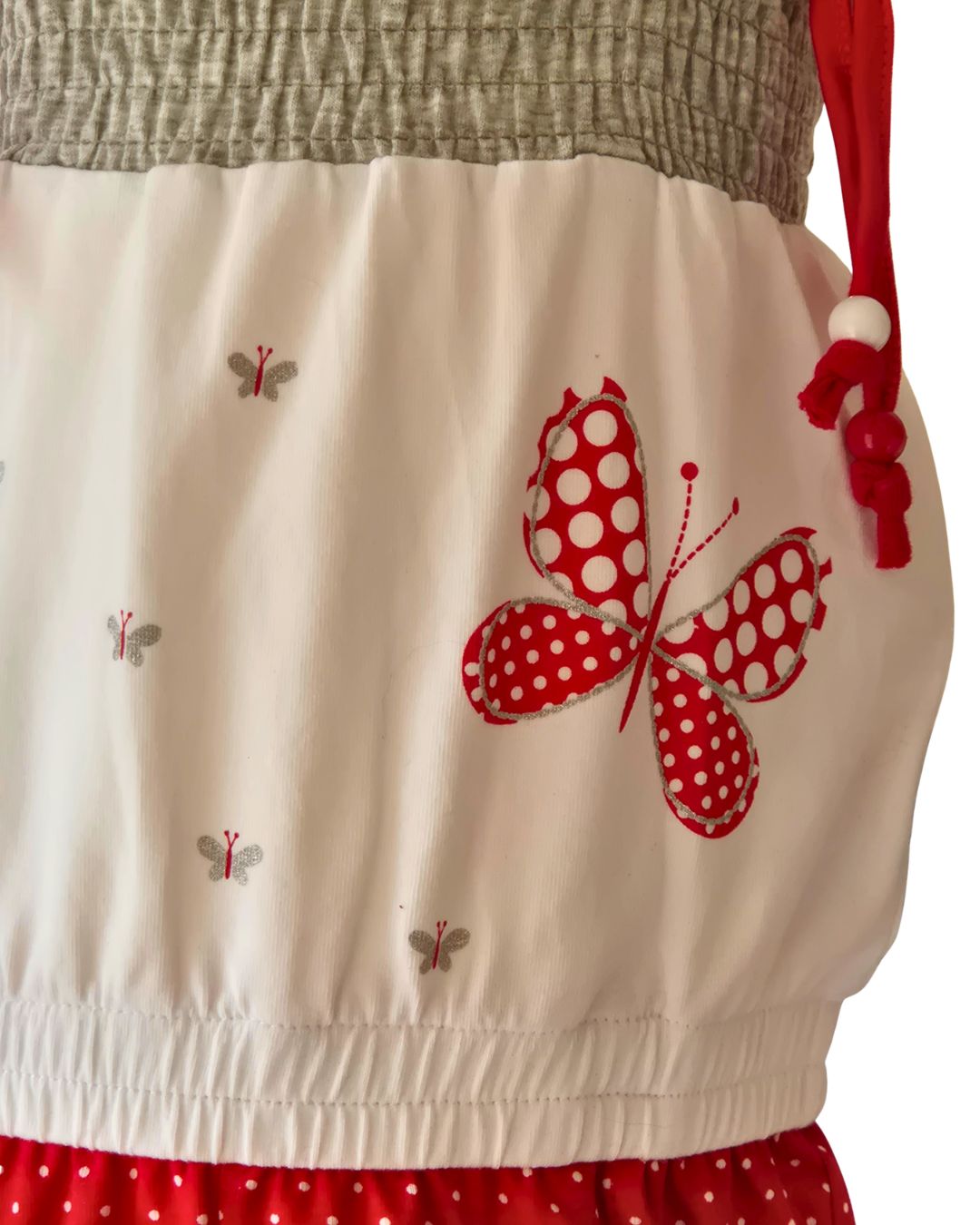 Red polka dot playsuit with tie straps and bead detail