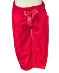 Girls red trousers with ribbon detail and pockets
