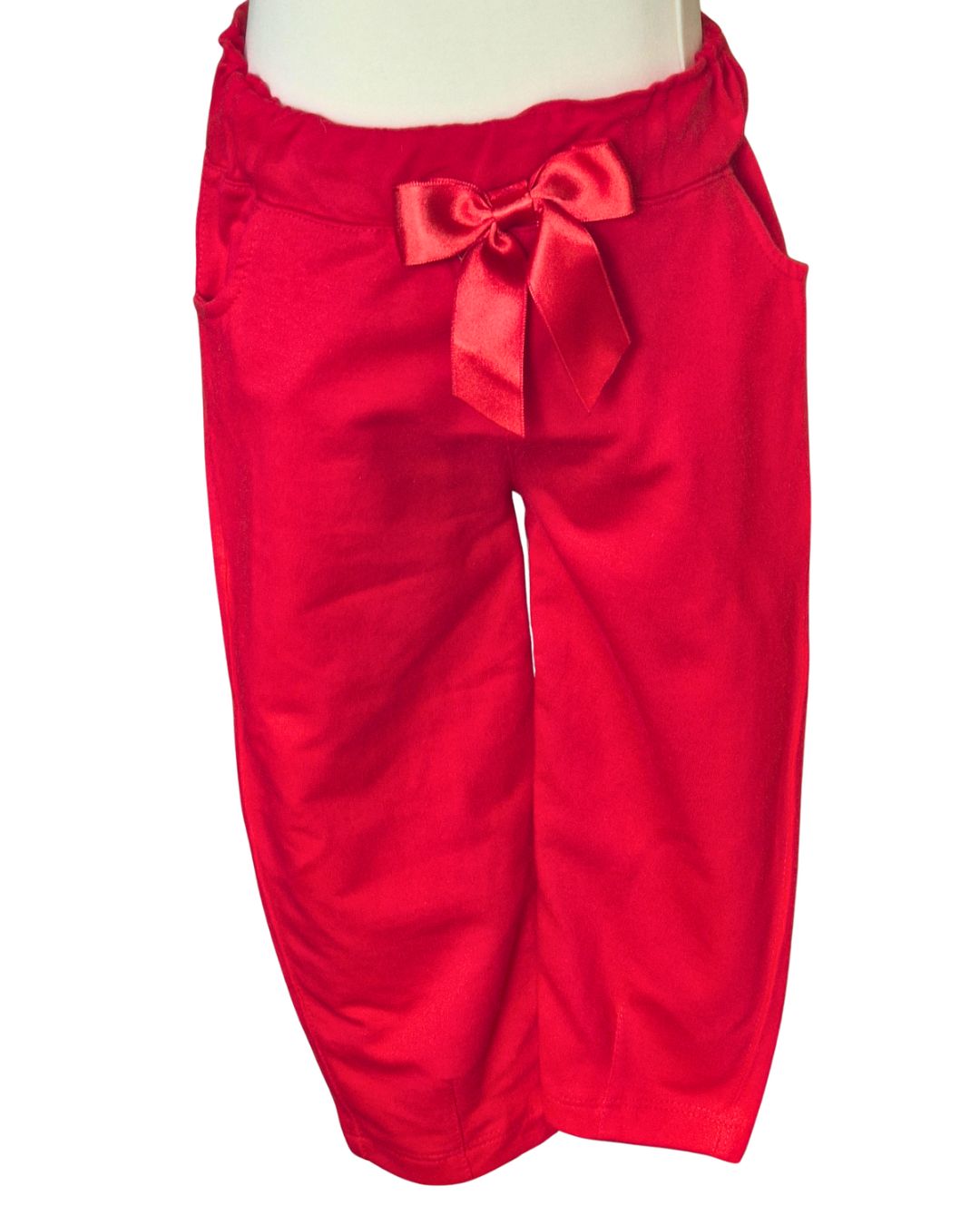Girls red trousers with ribbon detail and pockets