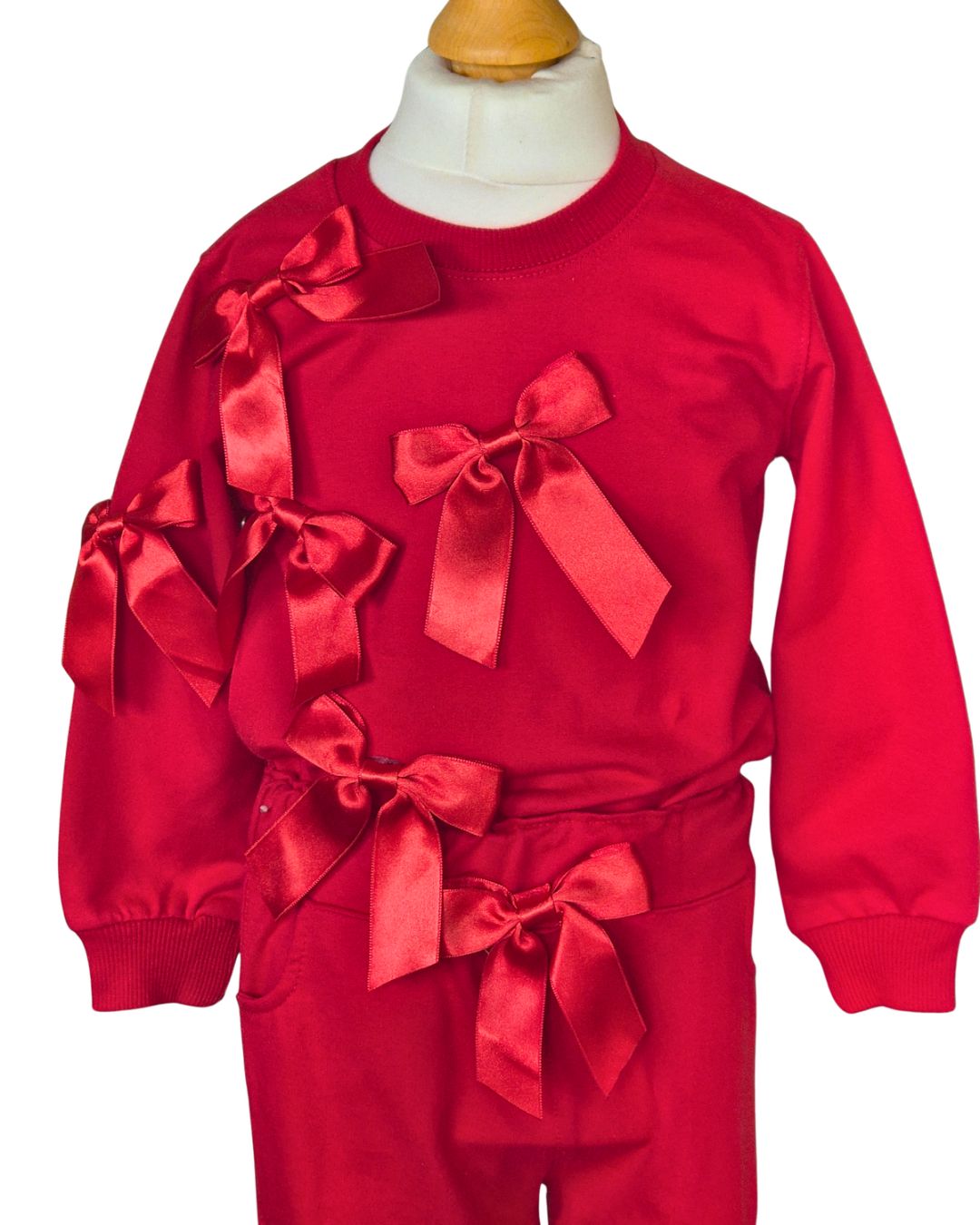 Girls red long-sleeved top with satin ribbons
