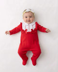 Red and white baby sleepsuit with frilled bib and bows