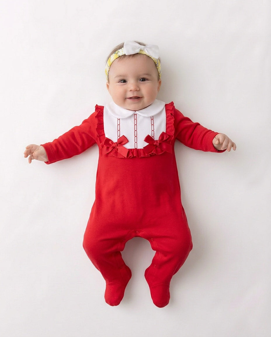 Red and white baby sleepsuit with frilled bib and bows