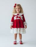 Girls red velvet and ivory frill Christmas dress with oversized bows and full skirt