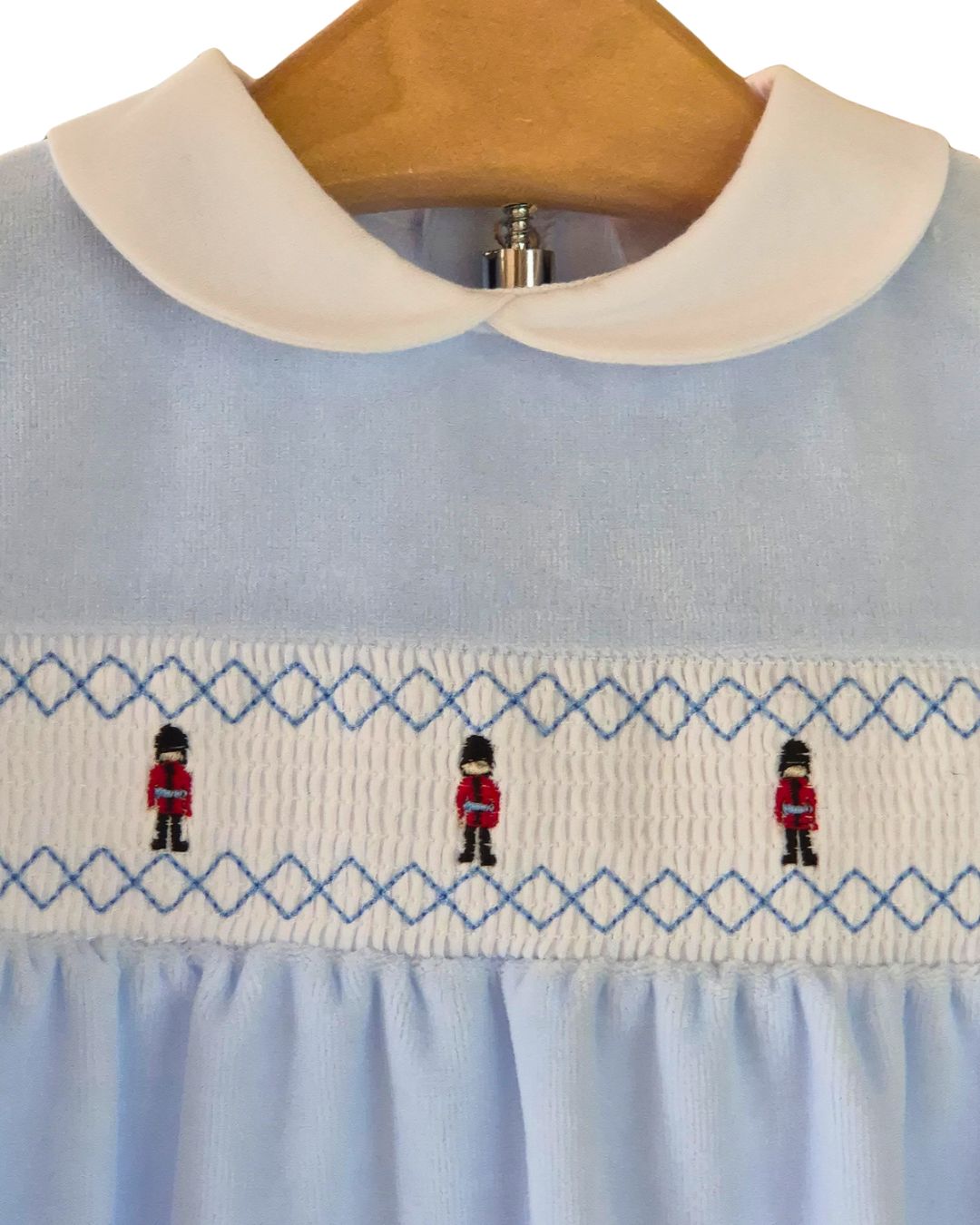 Traditional baby boy sleepsuit with red uniform soldiers