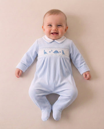 Boys sky blue velour dinosaur sleepsuit with embroidered dinosaurs and stars