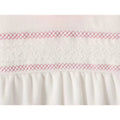 Baby white and pink smocked sleepsuit with lace trim