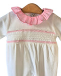Baby sleepsuit with pink criss-cross embroidery and white lace