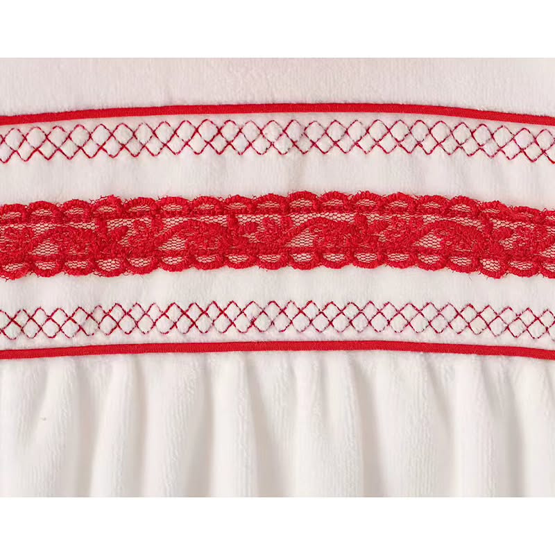 Soft velour baby sleepsuit with red embroidered chest panel