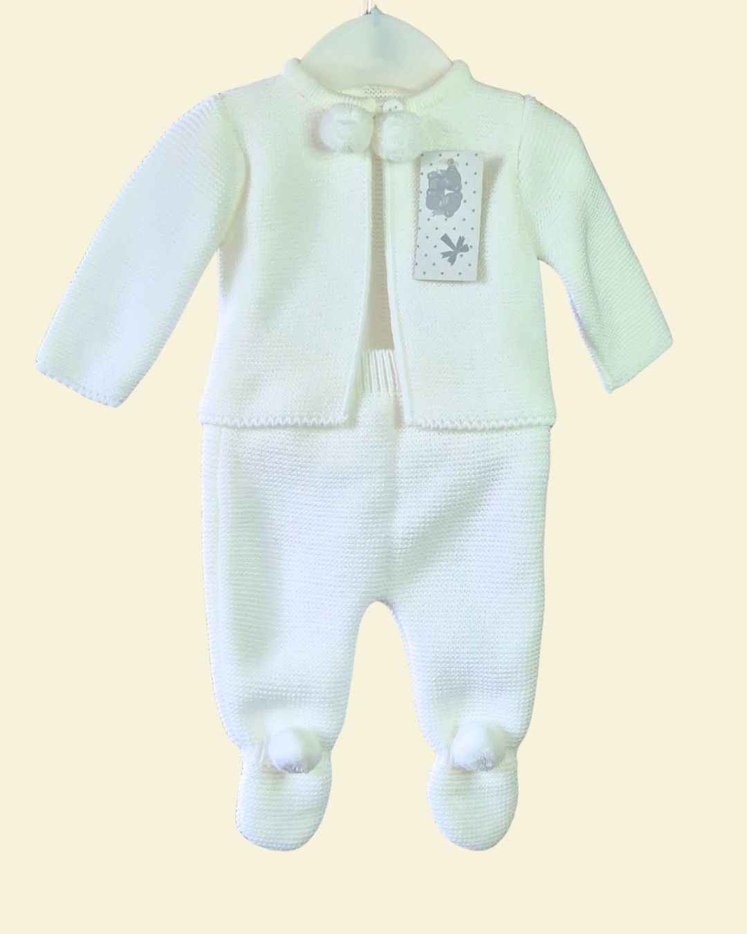 White knitted pom pom cardigan and trousers baby set