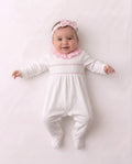Baby white and pink smocked velour sleepsuit with frill neckline
