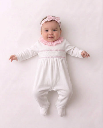 Baby white and pink smocked velour sleepsuit with frill neckline